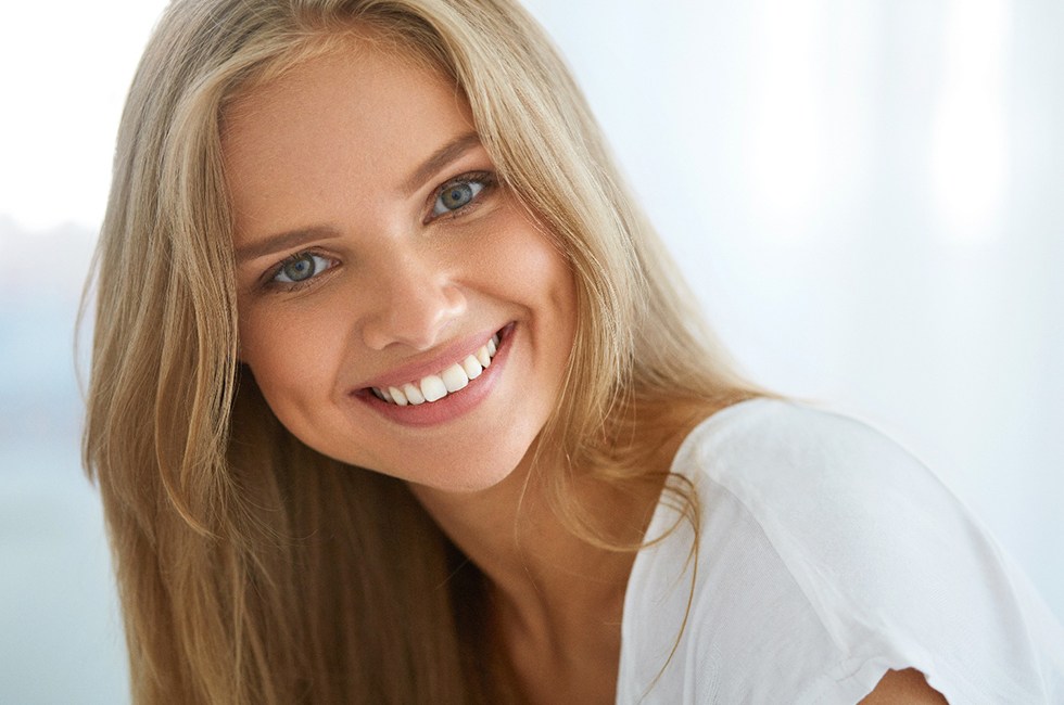 Woman with long blonde hair smiling