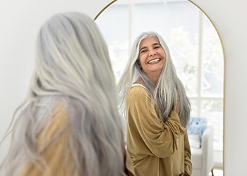 Dental implant patient in Midland smiling