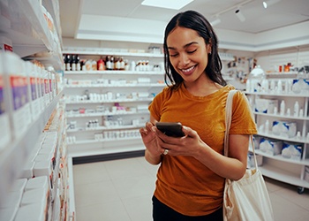Patient looking in pharmacy for whitening products