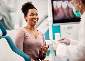 Patient smiling at dentist during consultation